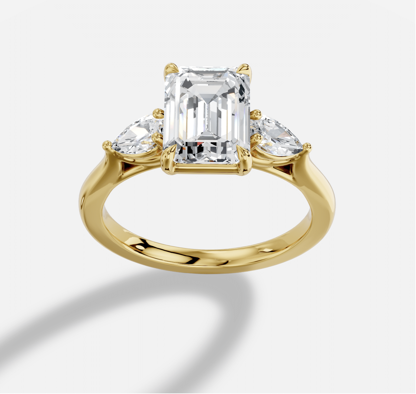 Emerald Cut Three Stone Diamond Ring  in 18K Yellow Gold