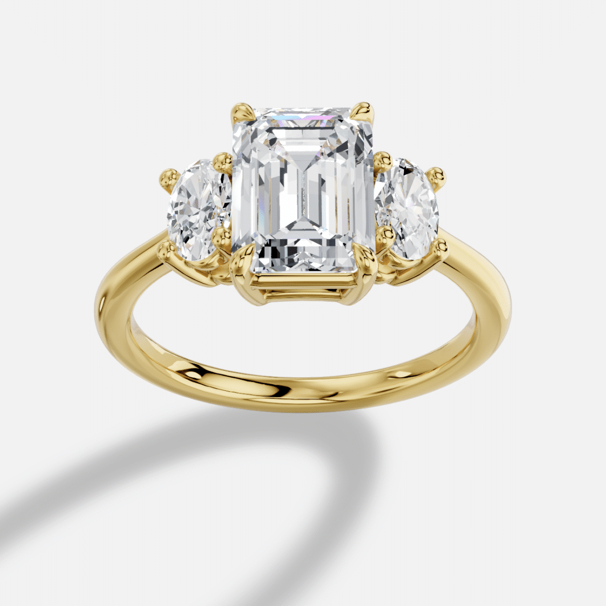 Emerald Cut Three Stone Diamond Ring  in 18K Yellow Gold