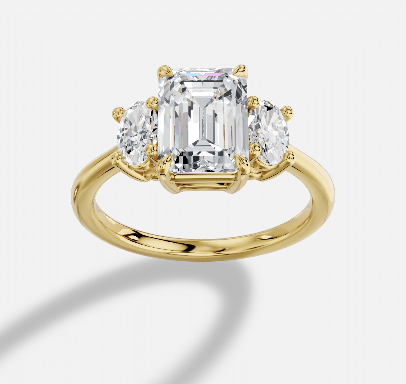 Emerald Cut Three Stone Diamond Ring  in 18K Yellow Gold