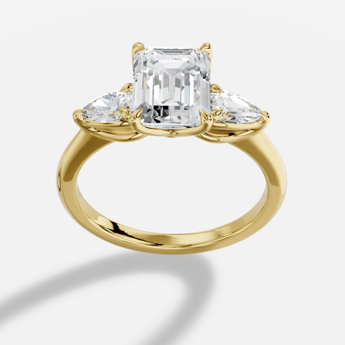 Emerald Cut Three Stone Diamond Ring in 18K Yellow Gold