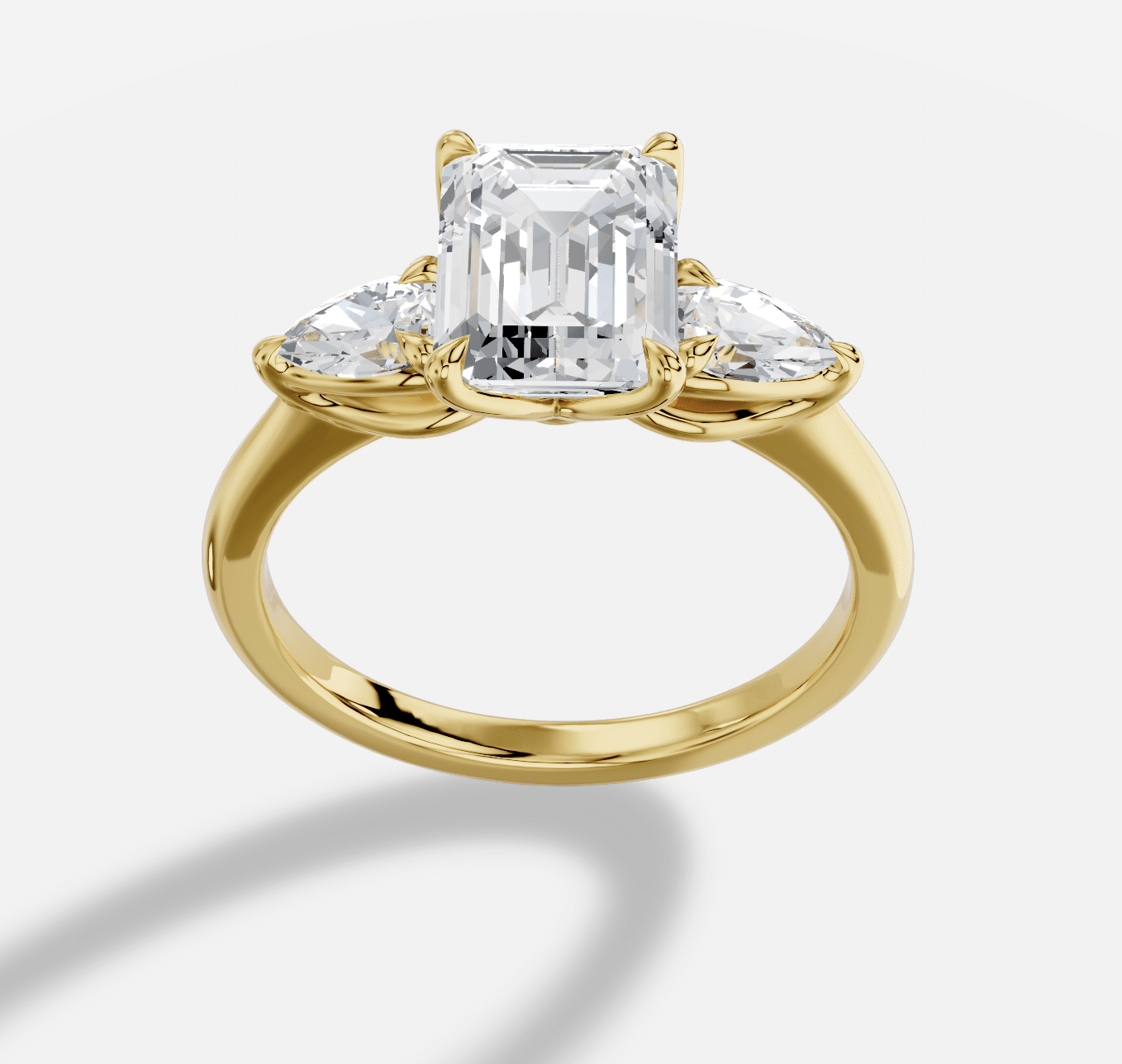 Emerald Cut Three Stone Diamond Ring  in 18K Yellow Gold